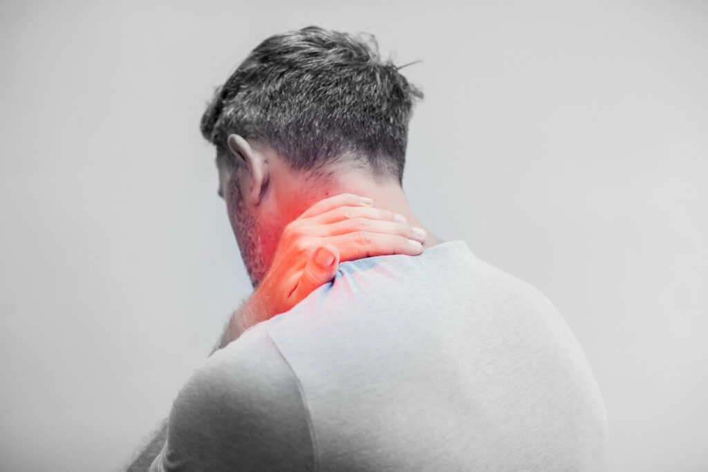 People, healthcare and problem concept - close up of man suffering from neck pain over gray background